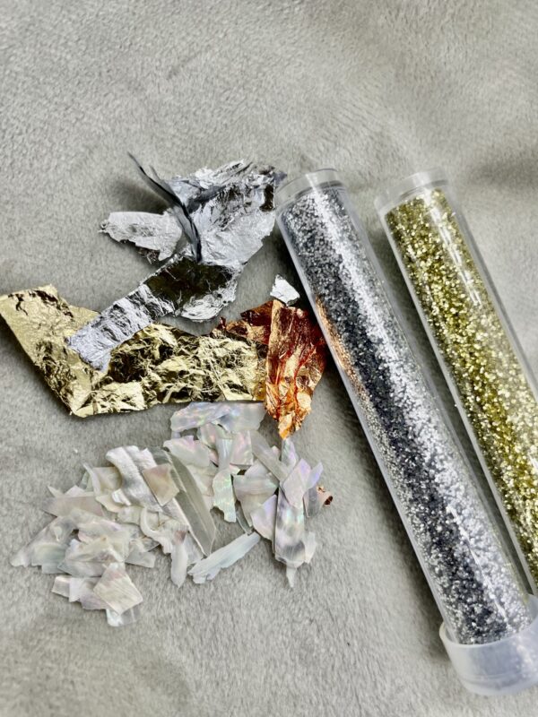 Vlokjes/glitters/parelmoer - Accessoires sieraad